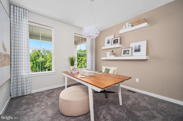 a workspace with furniture and window