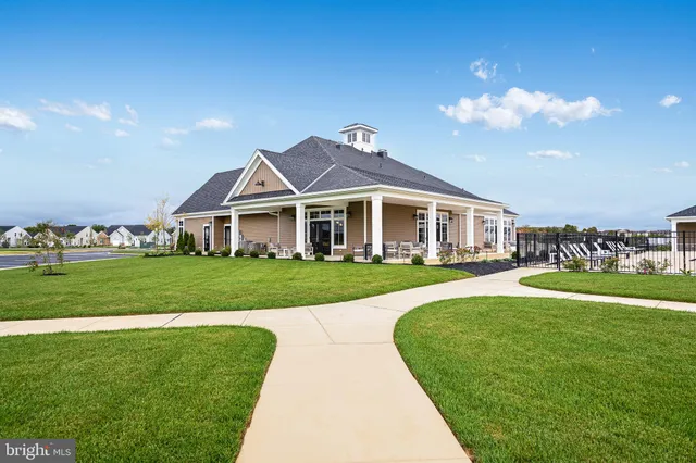 swimming pool view with a seating space