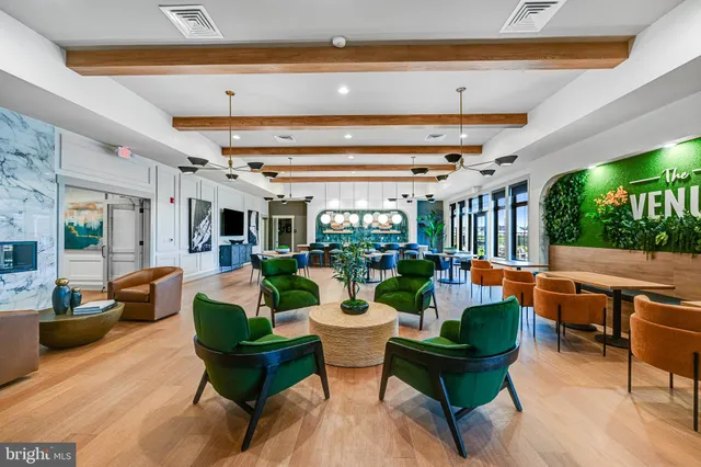 a large kitchen with a table and chairs in it