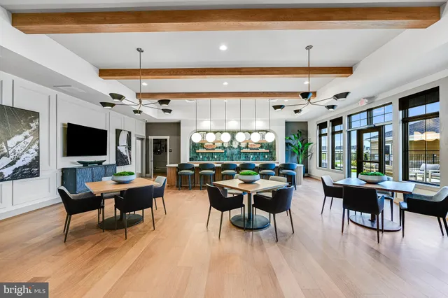 a living room with lots of furniture and a rug
