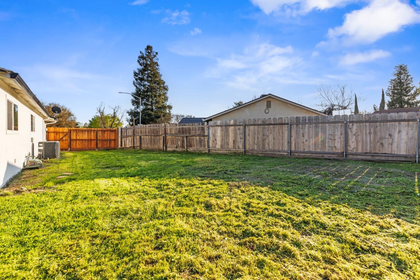 2425 Kildare Lane Modesto, CA 95354 - Photo 19 of 21 a view of a house with a yard