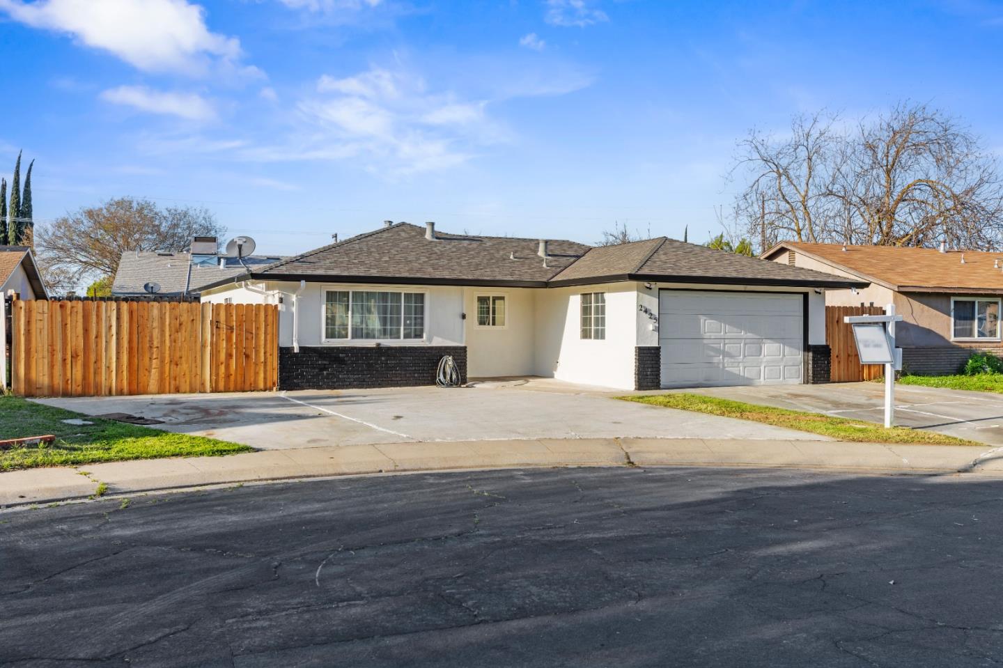 2425 Kildare Lane Modesto, CA 95354 - Photo 21 of 21 a front view of a house with a yard and garage