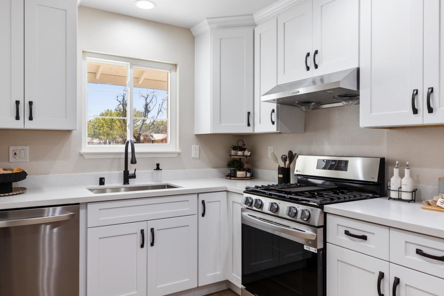 2425 Kildare Lane Modesto, CA 95354 - Photo 9 of 21 a kitchen with cabinets appliances a sink and a window