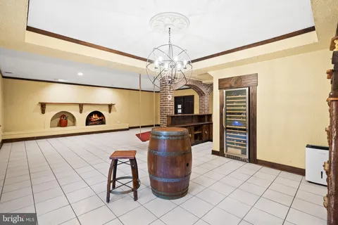 a view of a wooden chairs and table in patio