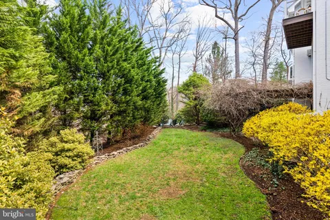 a view of a chairs and fire pit in the patio