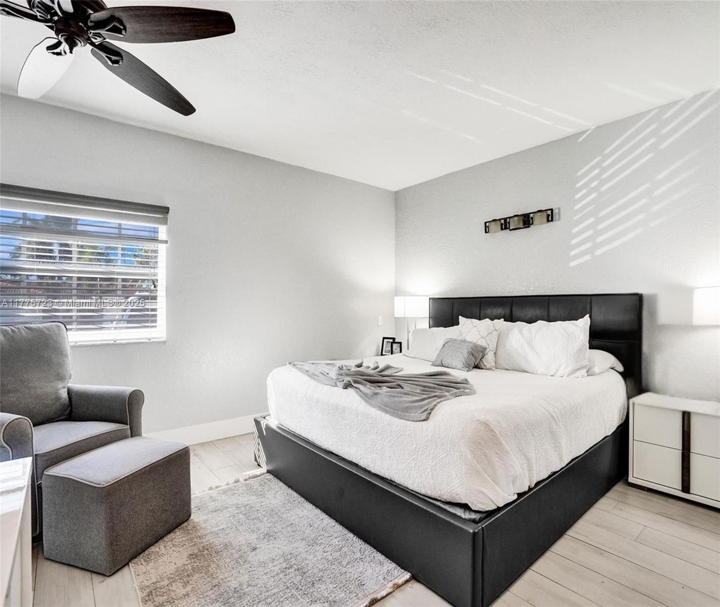 217 Southeast 5th Street Dania Beach, FL 33004 - Photo 13 of 26 a large bedroom with a bed and window