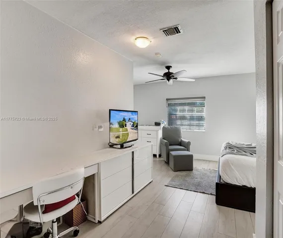 a room with a couch and a desk