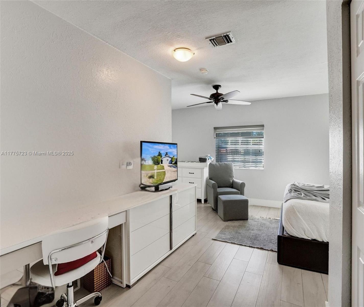 217 Southeast 5th Street Dania Beach, FL 33004 - Photo 14 of 26 a room with a couch and a desk