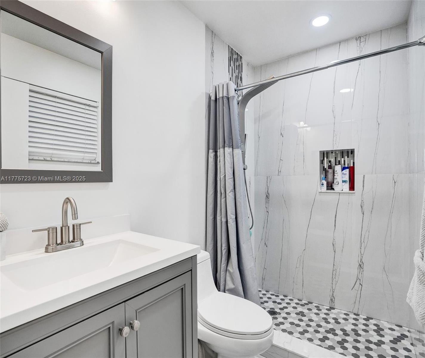 217 Southeast 5th Street Dania Beach, FL 33004 - Photo 17 of 26 a bathroom with a sink a toilet and shower