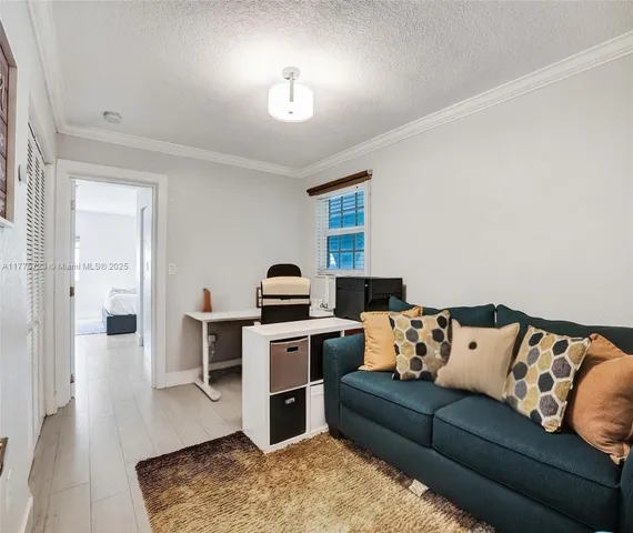 a view of a livingroom with furniture and wooden floor