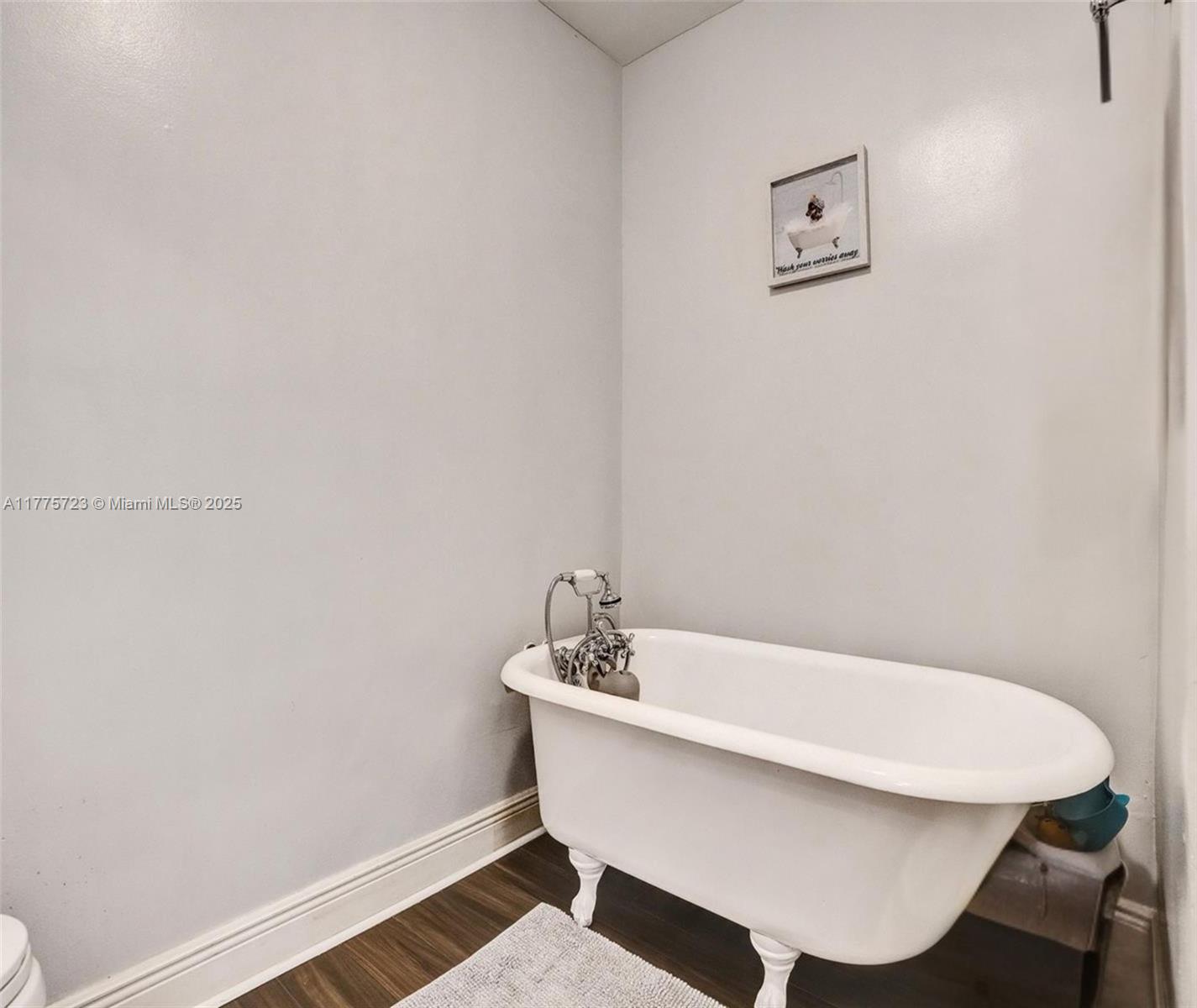 217 Southeast 5th Street Dania Beach, FL 33004 - Photo 22 of 26 a white bath tub sitting next to a white sink