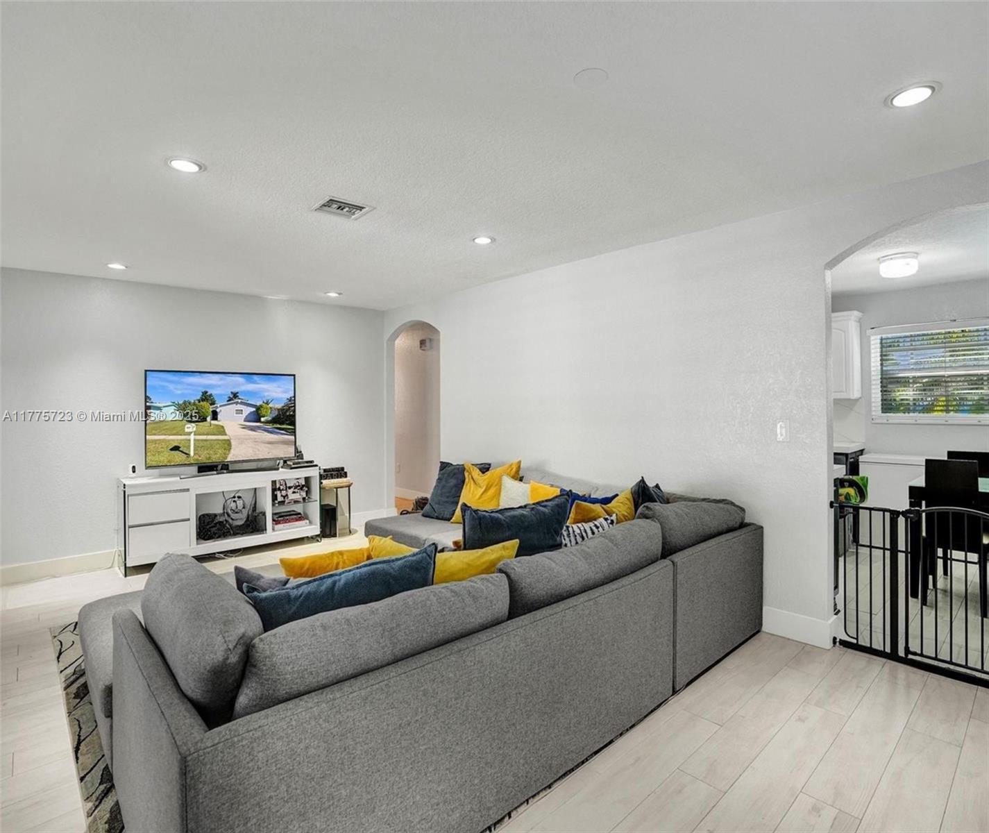 217 Southeast 5th Street Dania Beach, FL 33004 - Photo 10 of 26 a living room with furniture and a flat screen tv