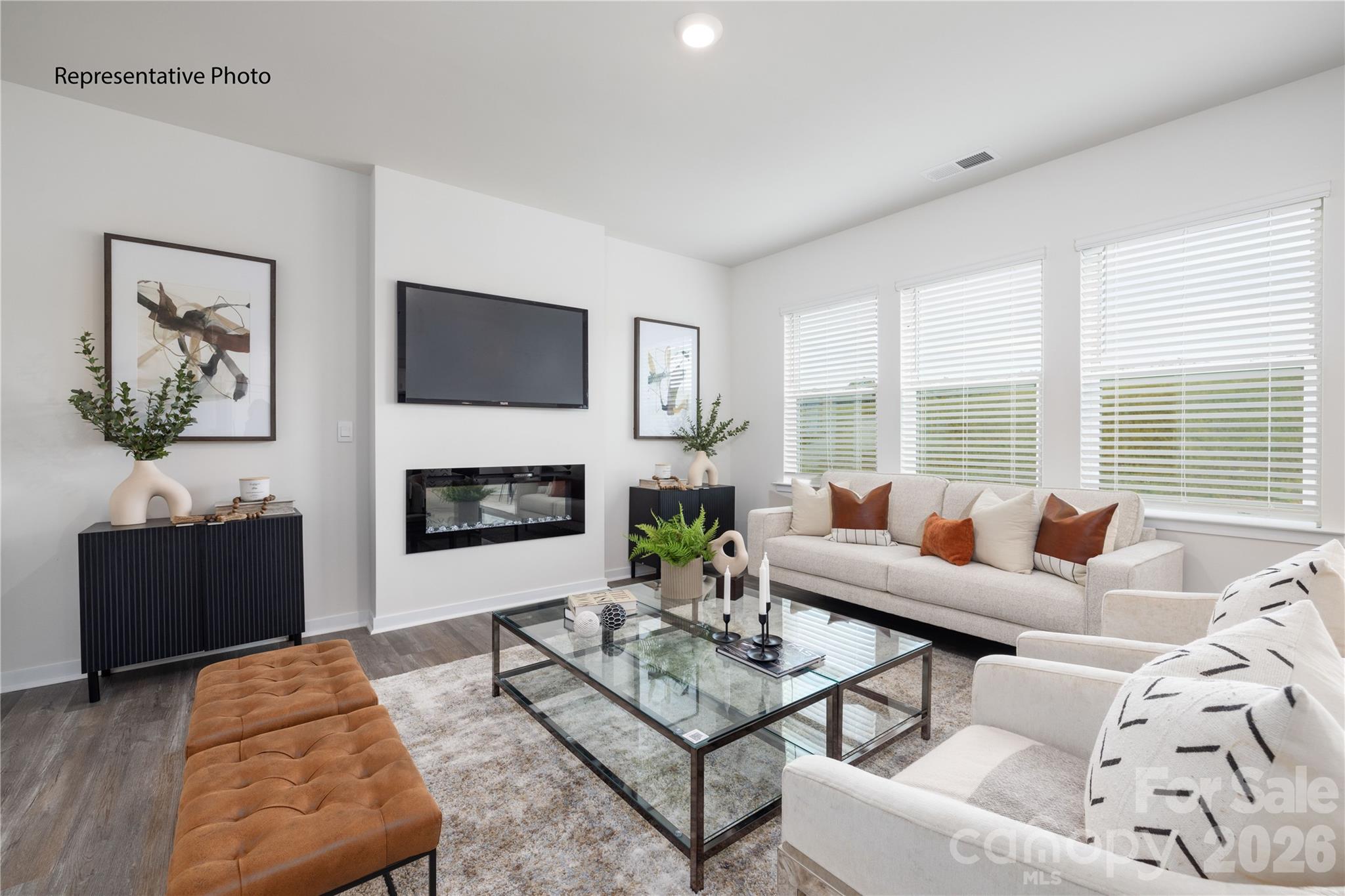 1406 Mammoth Road Hickory, NC 28602 - Photo 7 of 24 a living room with furniture a flat screen tv and a fireplace