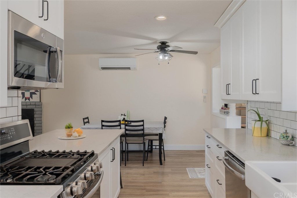 89 Glen Cir Drive Oroville, CA 95966 - Photo 11 of 32 a kitchen with a stove and a wooden floor