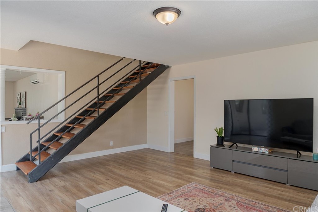89 Glen Cir Drive Oroville, CA 95966 - Photo 15 of 32 a living room with stairs and a flat screen tv