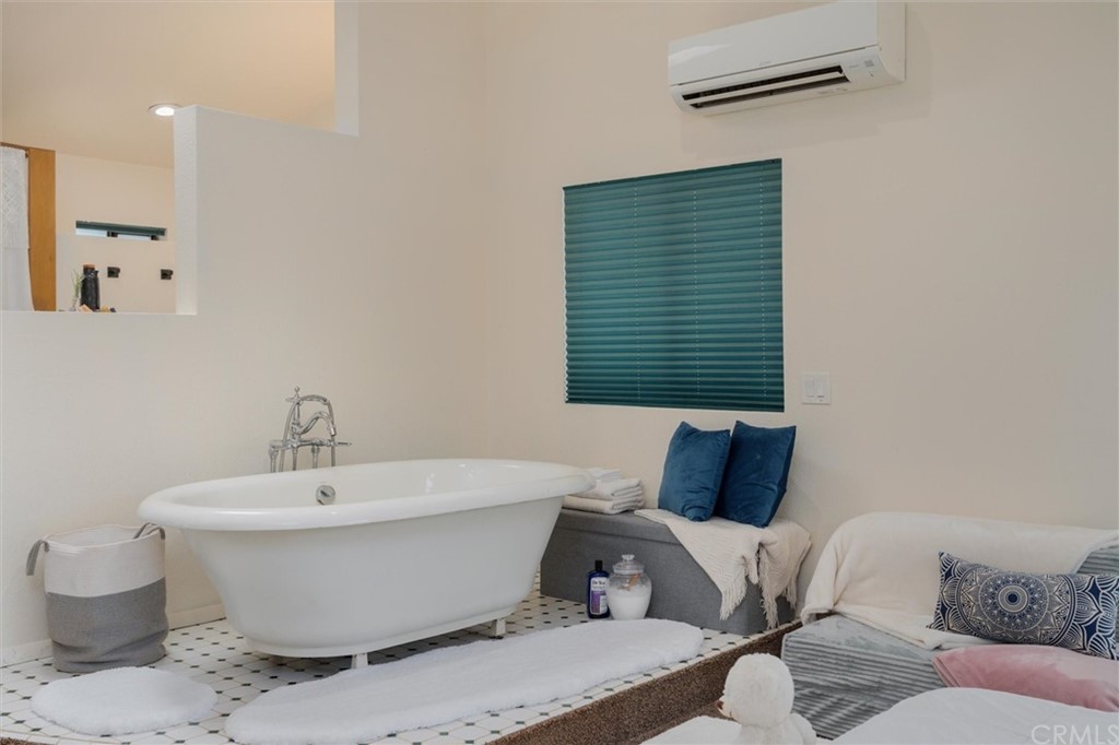 89 Glen Cir Drive Oroville, CA 95966 - Photo 19 of 32 a white room with a white bed and a potted plant