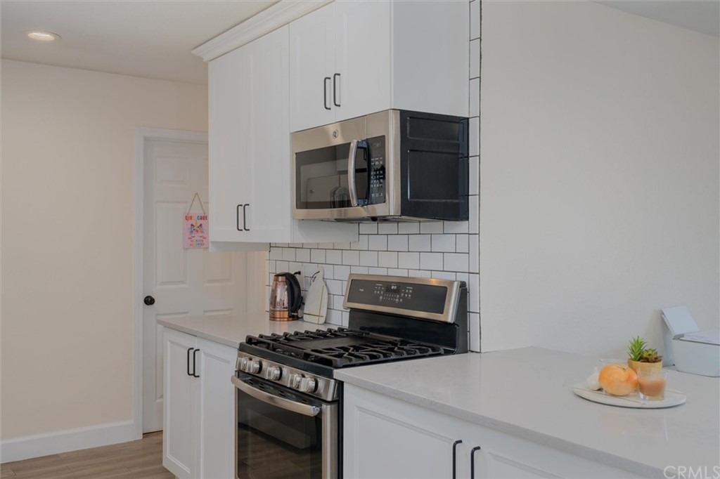 89 Glen Cir Drive Oroville, CA 95966 - Photo 10 of 32 a kitchen with stainless steel appliances a stove and a microwave
