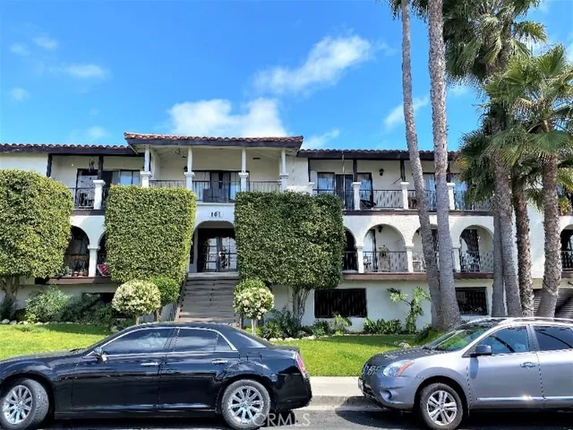 a front view of a house with parking space
