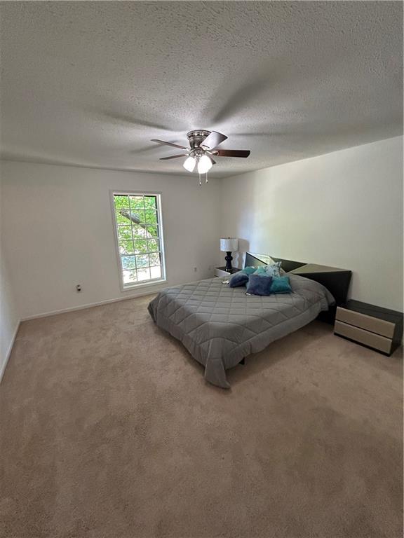 6851 Roswell Road, Unit O10 Atlanta, GA 30328 - Photo 11 of 20 an empty room with windows and fan