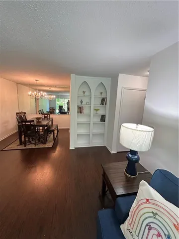 a living room with furniture and a chair