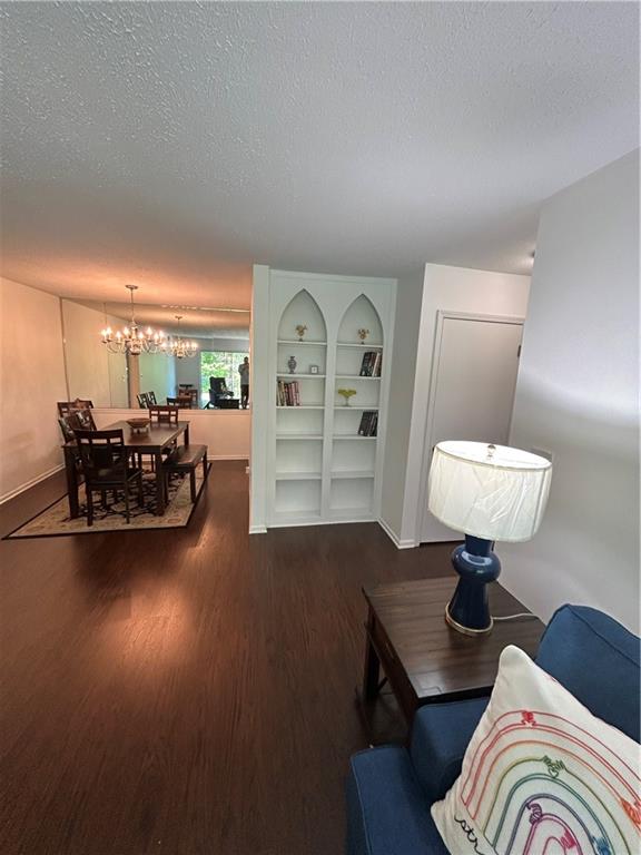 6851 Roswell Road, Unit O10 Atlanta, GA 30328 - Photo 13 of 20 a living room with furniture and a chair