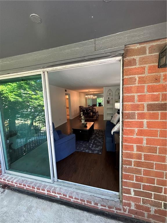 6851 Roswell Road, Unit O10 Atlanta, GA 30328 - Photo 15 of 20 a view of a living room and floor to ceiling window