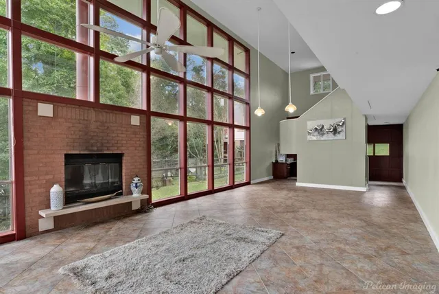 a large kitchen with stainless steel appliances a large counter top a stove a refrigerator a sink and dishwasher