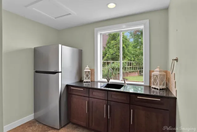 a bathroom with a tub shower and sink
