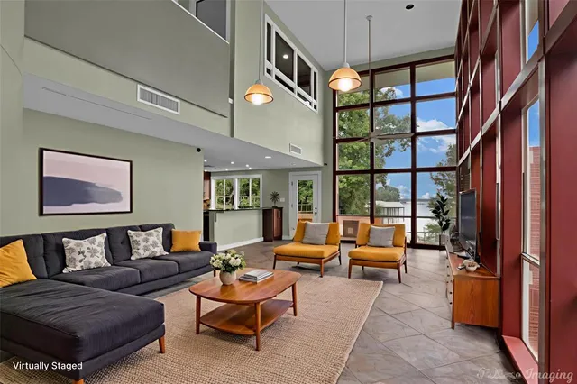 a view of an empty room with a fireplace and a window