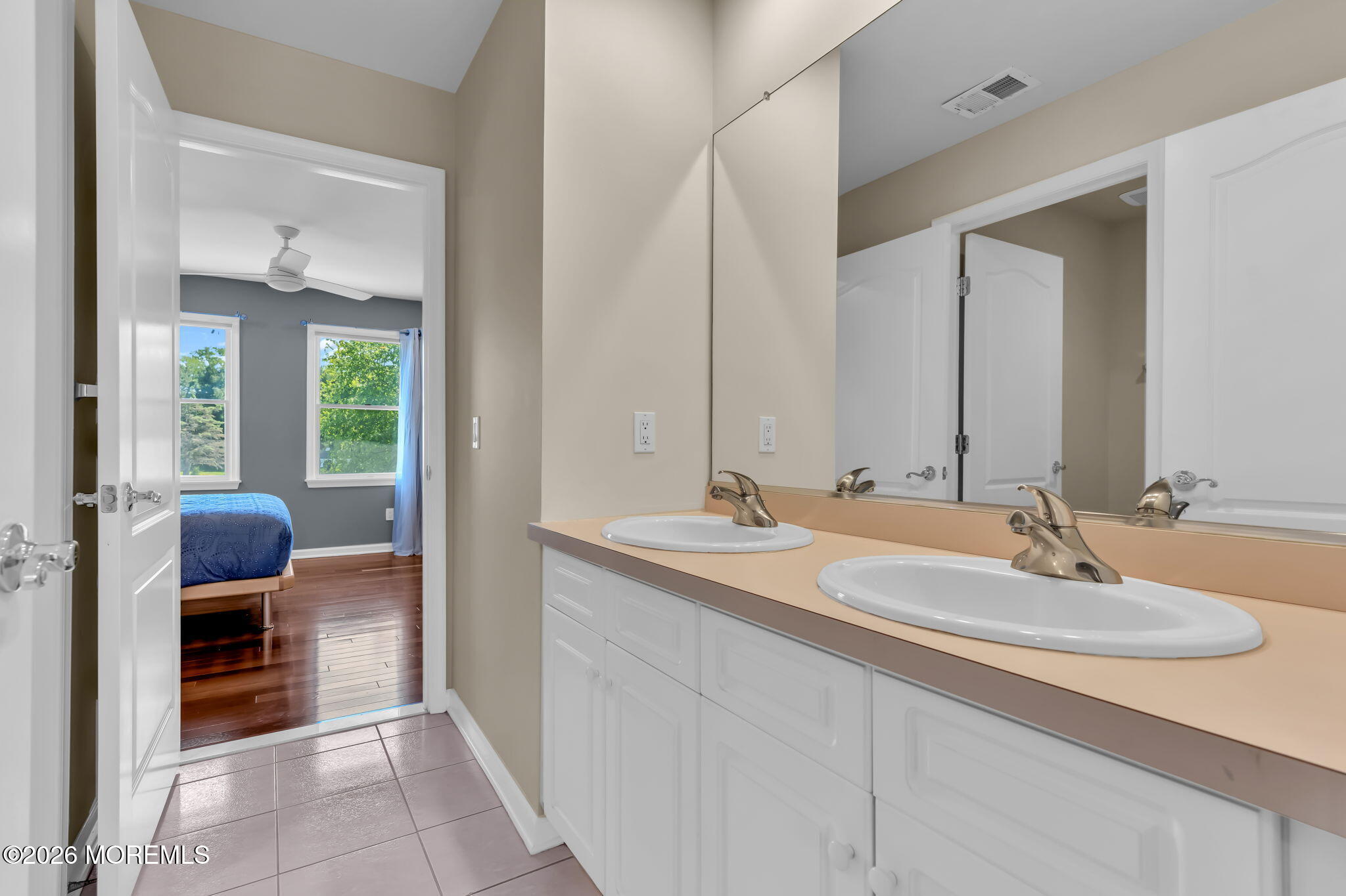 14 Diamond Hill Road Marlboro, NJ 07746 - Photo 52 of 79 a en suite bathroom with a double vanity sink and a mirror