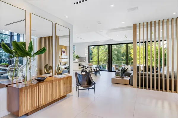 a large kitchen with a table and chairs
