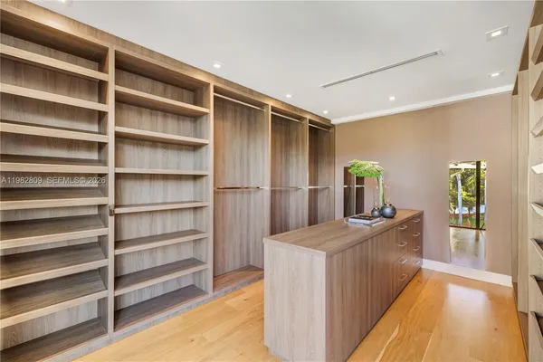 a view of yard from deck with patio