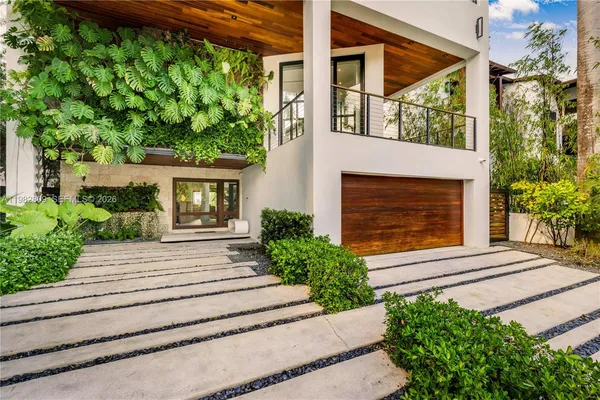 a view of a living room and balcony