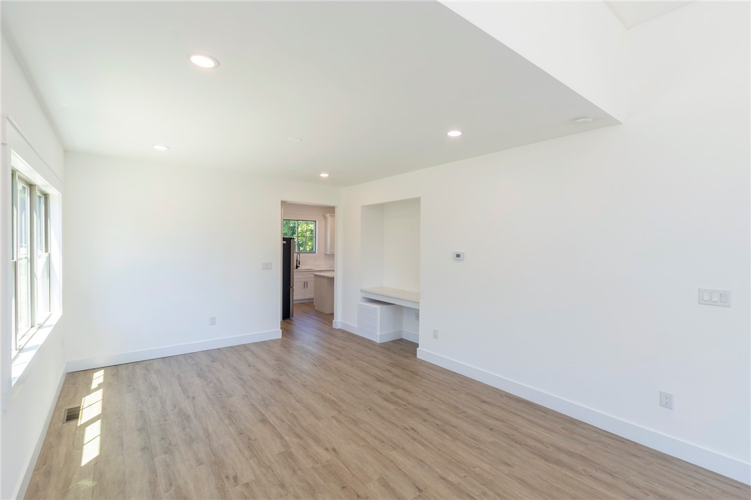 230 Hammond Circle Anderson, SC 29621 - Photo 6 of 48 This bright, airy room features warm wood flooring and an integrated desk area for convenience.