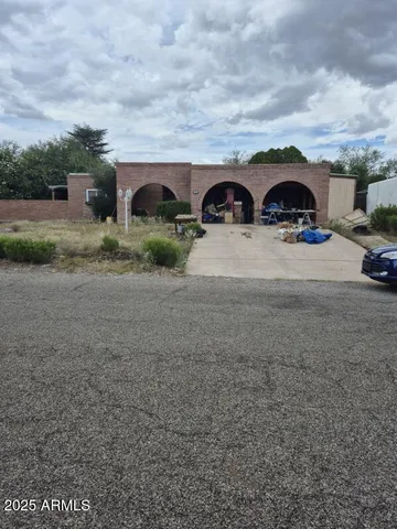 a view of a car parked in front of a house