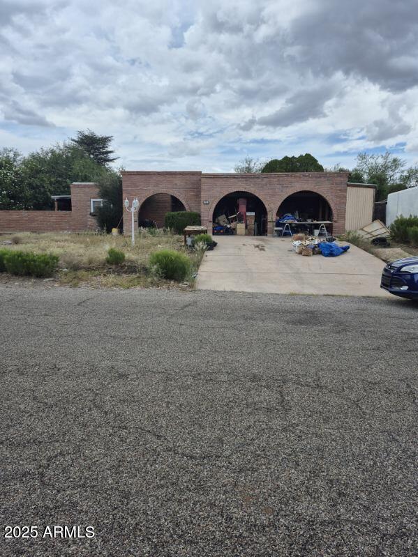 404 Calle Madrid Rio Rico, AZ 85648 - Photo 3 of 26 a view of a car parked in front of a house