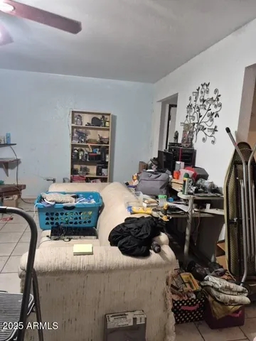 a room with a couch and a chandelier