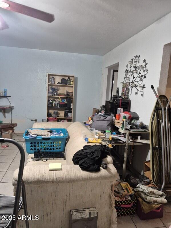 404 Calle Madrid Rio Rico, AZ 85648 - Photo 6 of 26 a room with a couch and a chandelier