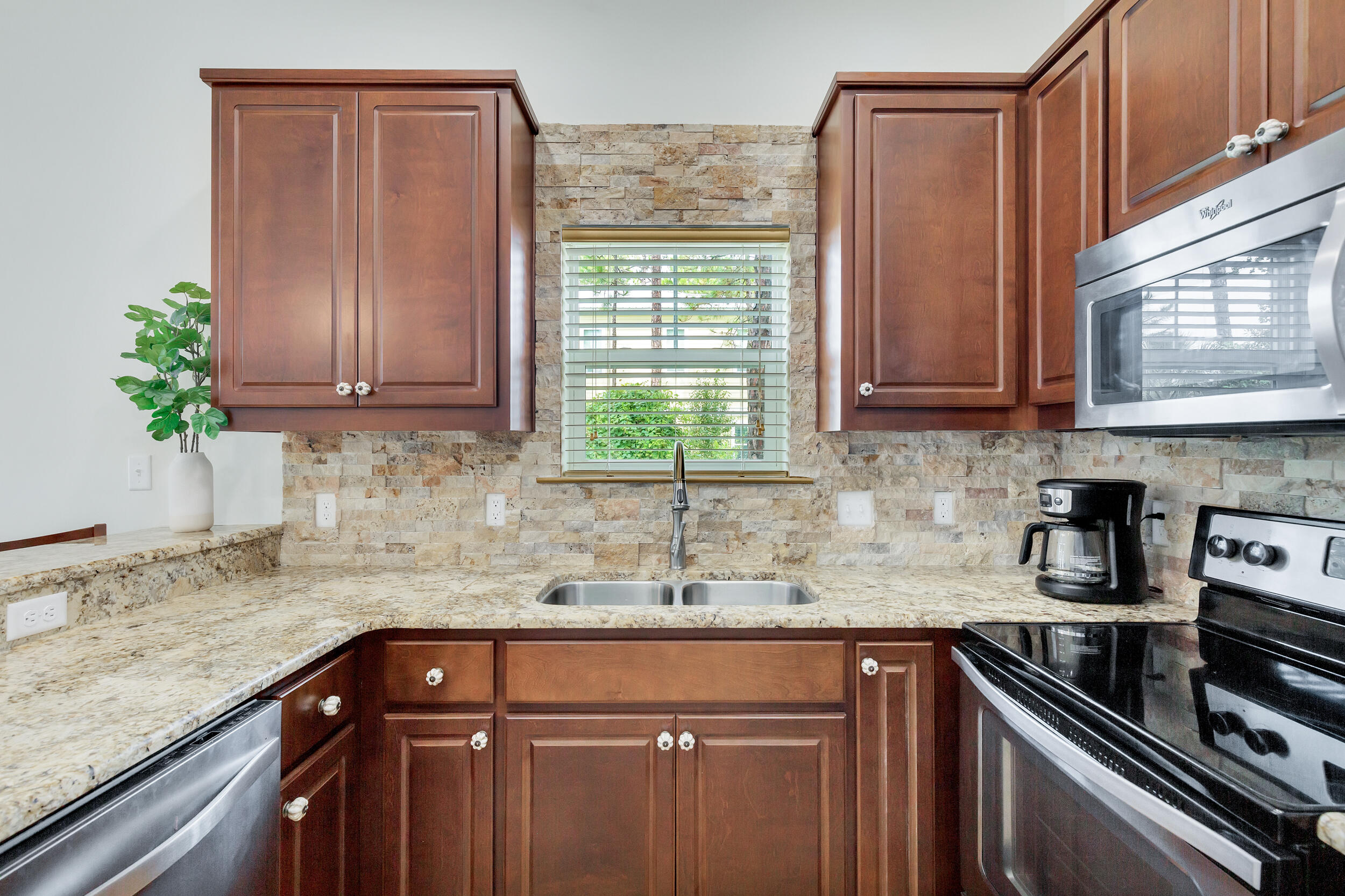 14 Crepe Myrtle Lane Santa Rosa Beach, FL 32459 - Photo 12 of 38 a kitchen with granite countertop cabinets sink and window