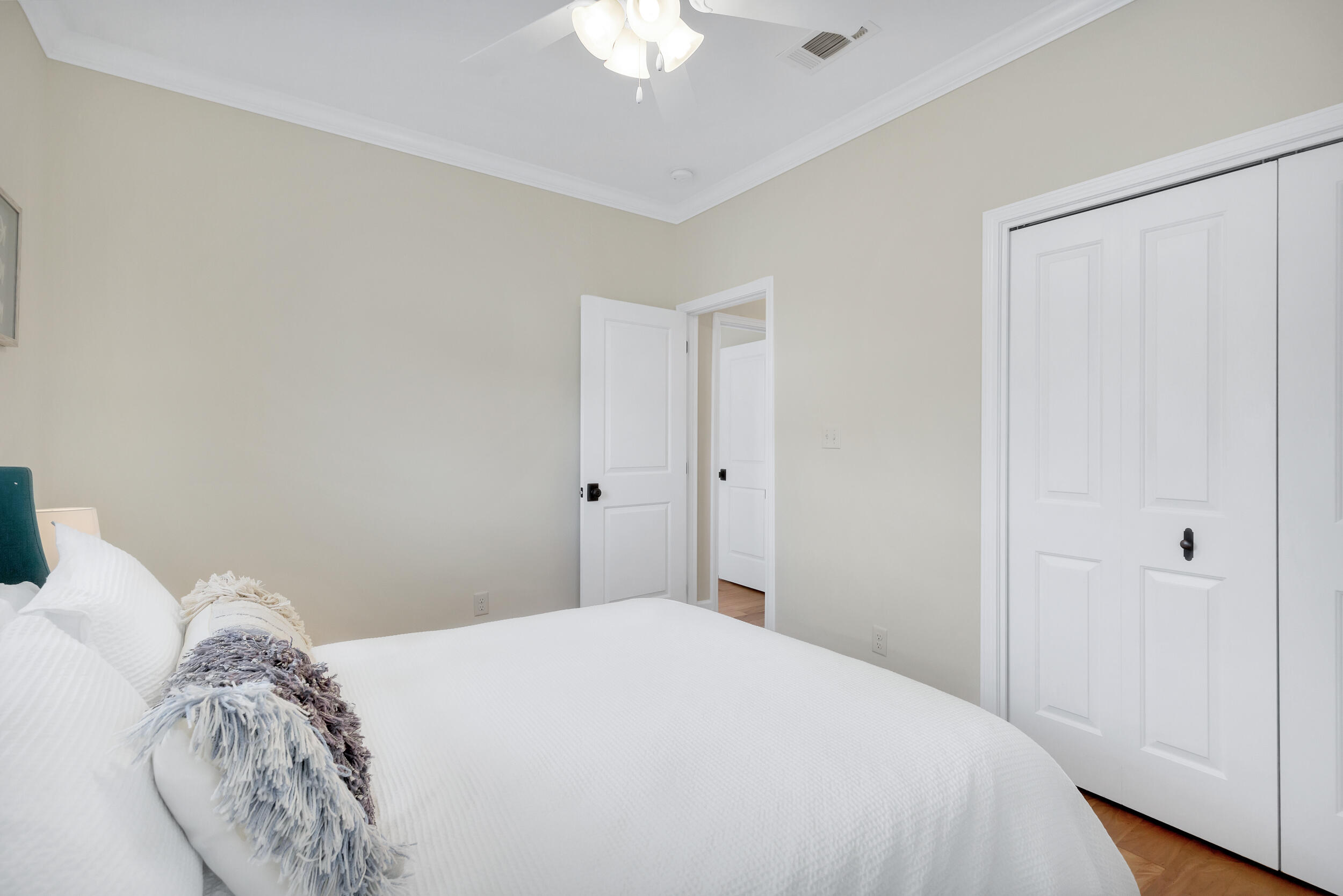 14 Crepe Myrtle Lane Santa Rosa Beach, FL 32459 - Photo 25 of 38 a bedroom with a bed and a chandelier