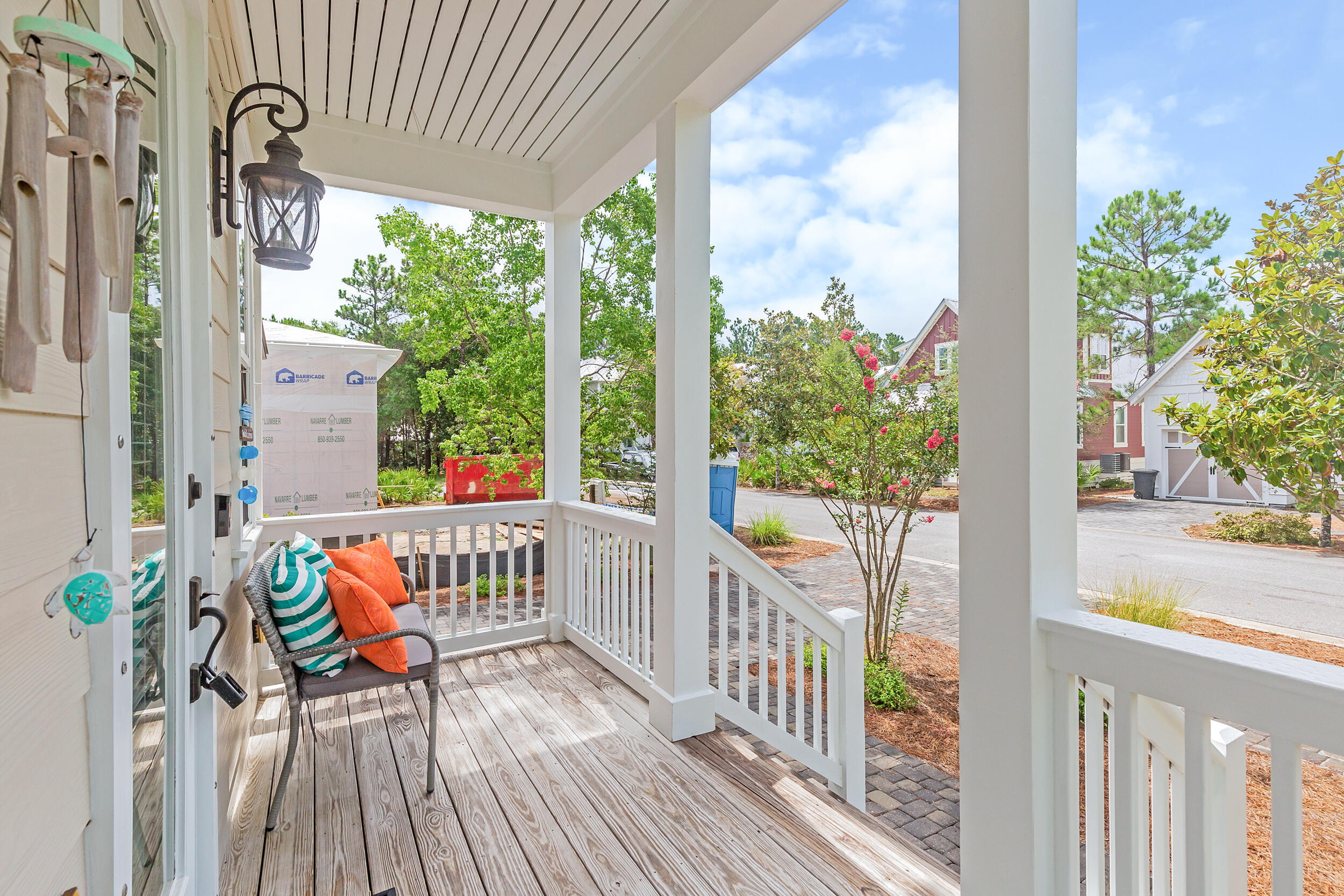 14 Crepe Myrtle Lane Santa Rosa Beach, FL 32459 - Photo 3 of 38 a view of a porch with chairs and wooden floor