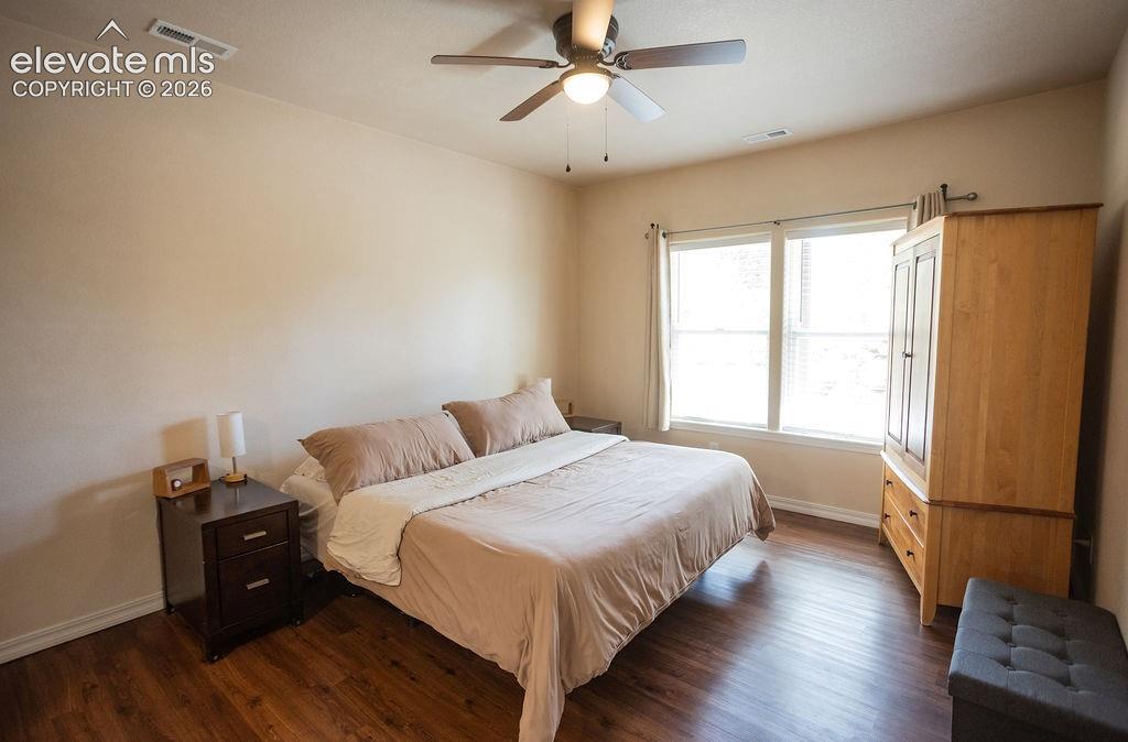 45 Valley Circle Divide, CO 80814 - Photo 19 of 42 a bedroom with a bed and wooden floor