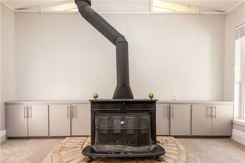 a close view of a fireplace in a white cabinet