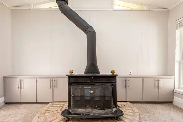 a close view of a fireplace in a white cabinet
