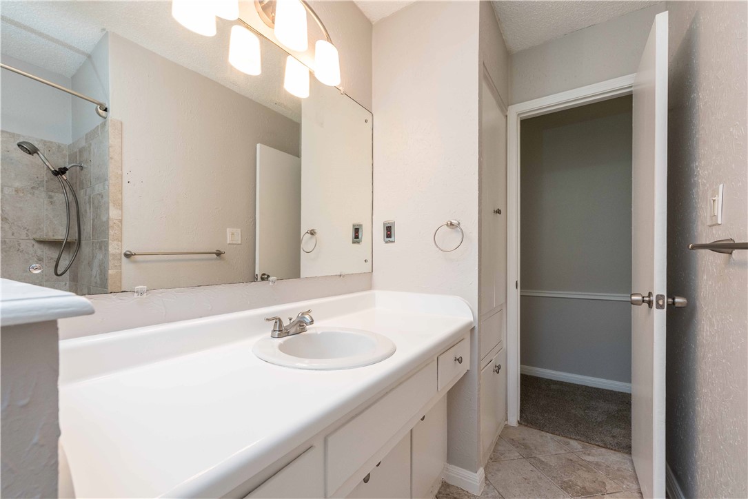 5505 Pendleton Lane Austin, TX 78723 - Photo 25 of 30 a bathroom with a sink double vanity and a mirror