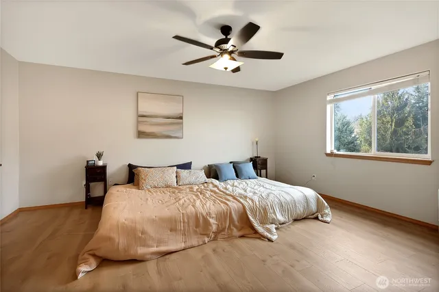 a bedroom with a bed and window