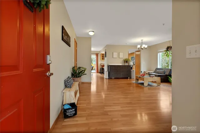 a room with furniture and a table with wooden floor