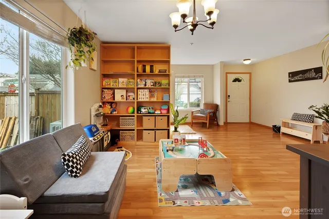 a living room with furniture or couch and a bookshelf