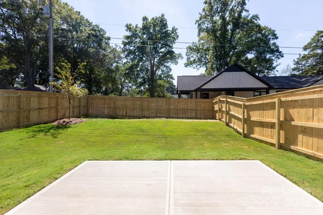 a view of a backyard with a small cabin