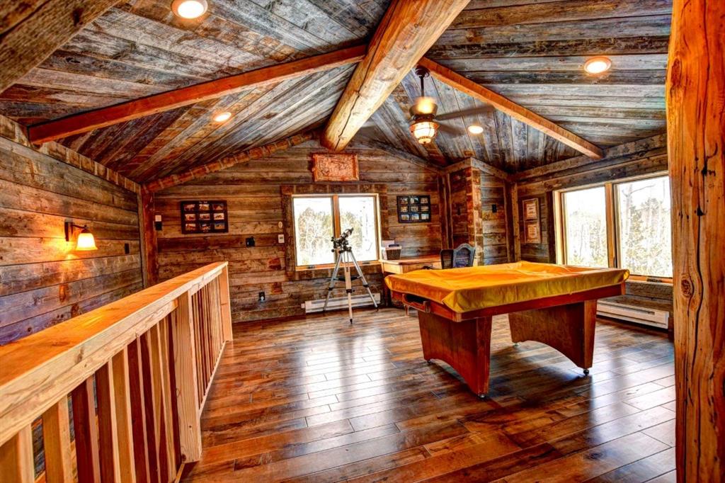 883 Osprey Road Como, CO 80432 - Photo 5 of 30 a view of a room with wooden floor and iron stairs